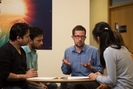 Image of multiple people meeting together